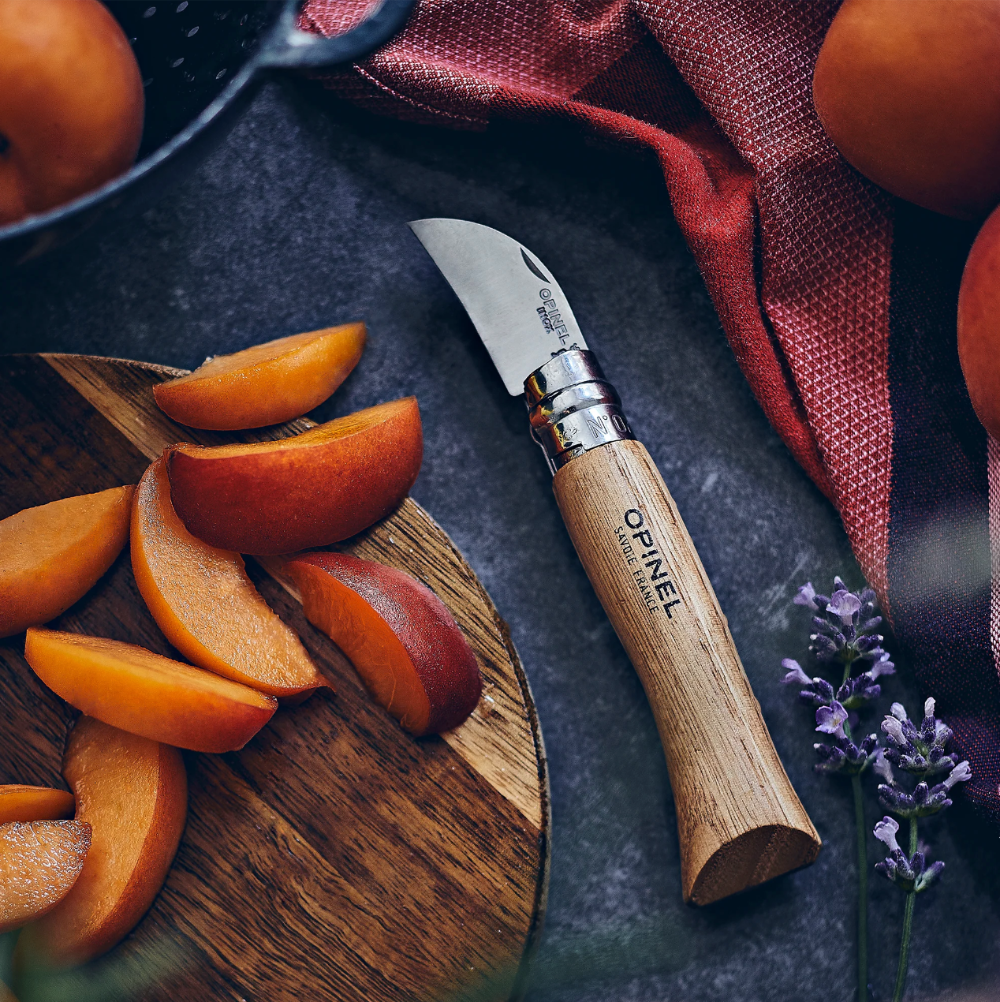 Opinel N°07 Chestnut and Garlic Knife on a table