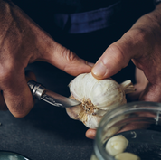 Opinel N°07 Chestnut and Garlic Knife peeling a garlic